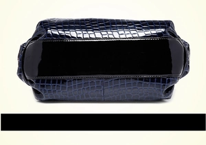 Detailed bottom view of navy blue faux crocodile leather handbag with glossy finish