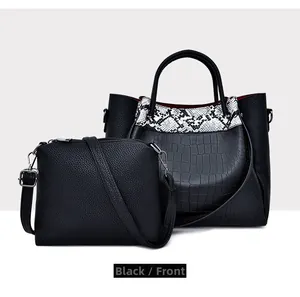 Front view of two-piece black handbag set with crocodile texture and shoulder strap