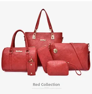 Detailed view of the red 6-piece tote bag set with pebble grain texture and gold hardware