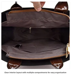 Detail view of large crocodile pattern handbag interior with multi-compartment storage