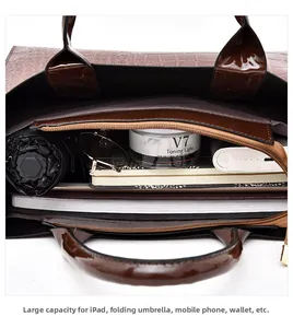 Detail view of large capacity tote bag interior with iPad, umbrella, and daily essentials