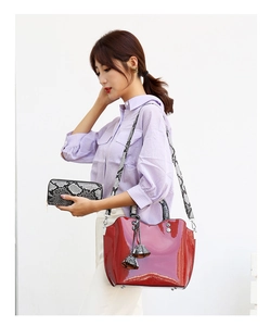 Polished wine red patent leather tote bag with snakeskin pattern strap and wallet
