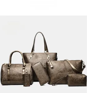 Detailed six-piece brown tote set featuring 3D rose embossing on textured faux leather