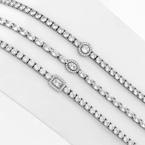 Elegant stainless steel tennis bracelets featuring round, oval, and emerald cut crystals
