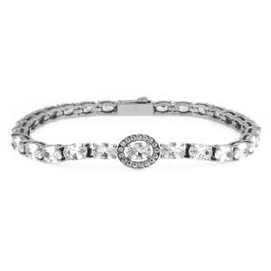 Macro detail of silver tennis chain featuring a large oval zirconia centerpiece and halo