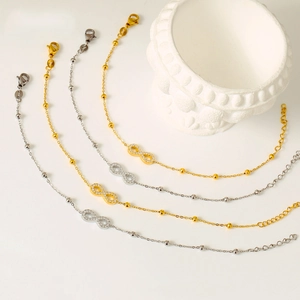 Titanium steel infinity symbol bracelets with zircon accents in gold and silver set