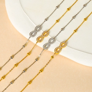 Titanium infinity symbol bracelets with cubic zirconia in gold and silver finishes