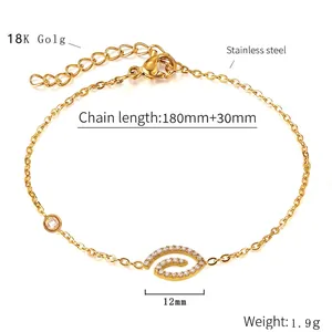 Detail of 18K gold stainless steel bracelet with cubic zirconia charms and extension chain