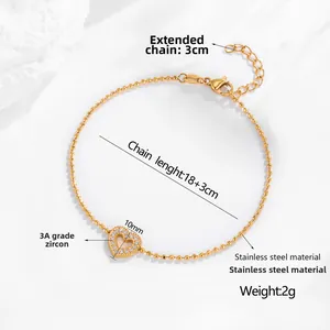Detail of gold heart charm with 3A zircon stones and stainless steel bead chain