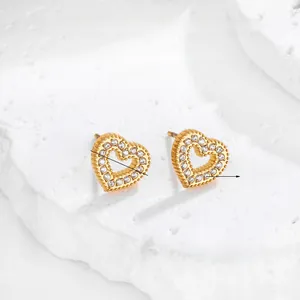 Detailed macro view of 18K gold plated heart earrings with sparkling 3A grade zircons