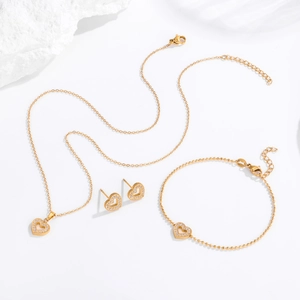 Luxurious gold heart jewelry set with sparkling pavé crystals necklace bracelet earrings