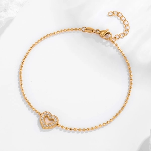 Elegant gold heart bracelet with micro-paved diamonds on a delicate ball chain