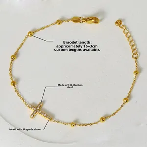 Bracelet croix en acier titane plaqué or 18 carats avec oxydes de zirconium