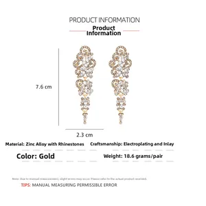 Detailed technical diagram showing long gold-plated drop earrings with white rhinestones