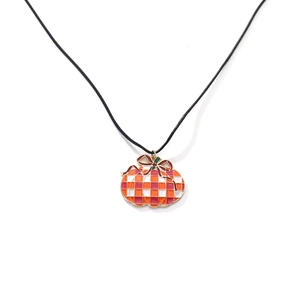 Plaid pumpkin pendant necklace with festive bow on a minimalist black cord