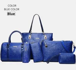 Blue 6-piece handbag set featuring embossed rose texture and elegant golden zippers