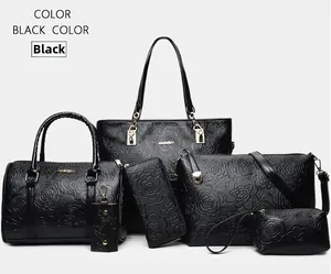 6-piece black faux leather handbag set with embossed floral patterns and gold hardware