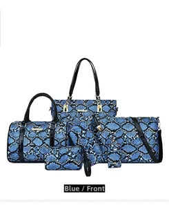 Detail of 6-piece blue snakeskin patterned bag set including tote and boston bags