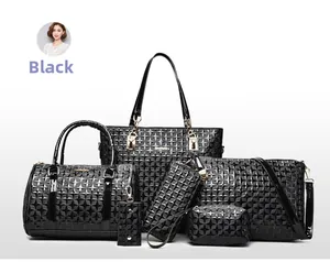 Detail of 6-piece black handbag set featuring textured faux leather and gold zippers