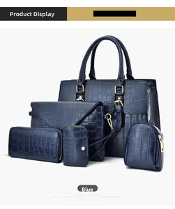 Detailed view of 5-piece blue crocodile pattern handbag set with golden hardware details