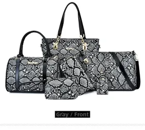 Front view of a 6-piece grey snakeskin patterned handbag set with golden hardware