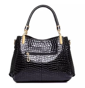 Classic black crocodile pattern handbag with glossy finish and gold-tone hardware detail