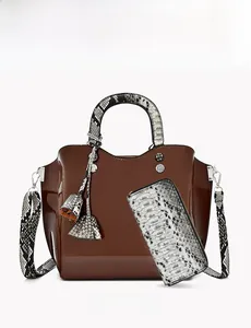 Brown patent leather handbag set with snake skin texture straps and matching wallet