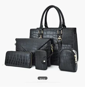 Detailed set of black crocodile pattern handbags with five pieces and gold hardware detail