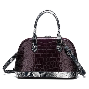 Deep purple crocodile embossed shell handbag with contrasting snakeskin straps and handles