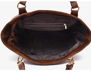 Detailed interior of brown tote bag featuring a zipper pocket and dual slot compartments