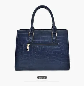 Rear view of dark blue crocodile embossed leather tote bag with gold hardware and zip pocket