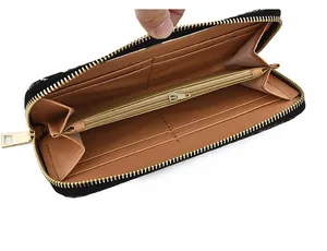 Detail showing inner card slots and zipper pocket of the black snakeskin wallet