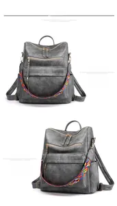 Dettaglio di zaino vintage grigio in finta pelle con tracolla etnica intrecciata