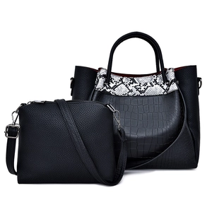 Black crocodile pattern tote bag set with snakeskin detail and matching crossbody purse