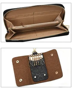 Detail view of leather wallet interior pockets and key holder with six golden hooks