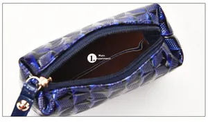 Detailed close-up of the main pocket on a blue geometric textured 3D cosmetic bag