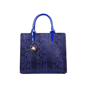 Navy blue snakeskin embossed Kelly style tote bag with decorative gold leaf charm