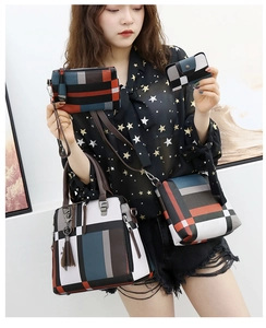 Detail of four-piece set of geometric patchwork handbags featuring color-block patterns