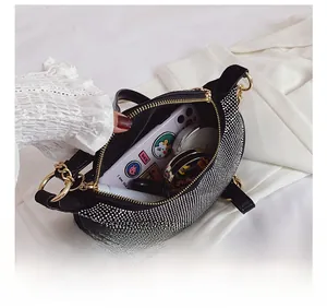 Interior view of rhinestone crossbody bag showing space for phone and makeup