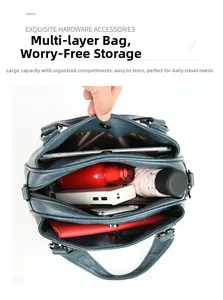 Internal view showing large capacity compartments for tablet and essentials in blue leather tote