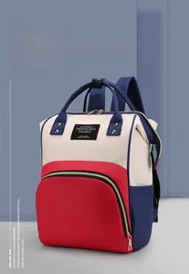Detail of color-block diaper bag featuring U-shaped zipper and high-density fabric
