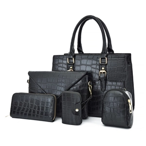 5-piece set of black crocodile embossed tote bags with gold hardware and accessories