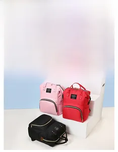 Detailed view of large capacity multi-pocket nylon backpacks in pink, red and black