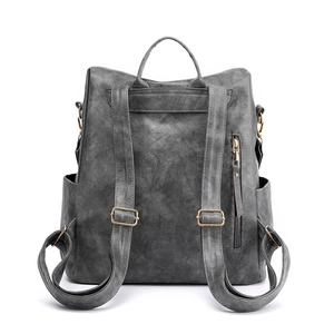 Zaino minimalista in pelle grigio scuro con spallacci regolabili e tasca antifurto