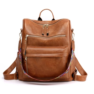 Zaino marrone in morbida pelle con tracolla etnica intrecciata e tasche zip