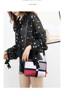 Fashionable crossbody bag featuring vibrant color-block geometric patchwork design