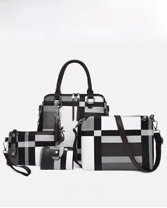 Detail view of 4-piece women's handbag set featuring grey and black plaid patchwork design