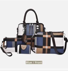 Detail view of the 4-piece handbag set in blue colorblock leather with tassel charm