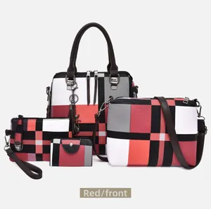 Detail view of four-piece handbag set featuring red, black, and grey geometric patchwork