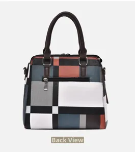 Back view of the geometric color block handbag featuring a functional zipper pocket
